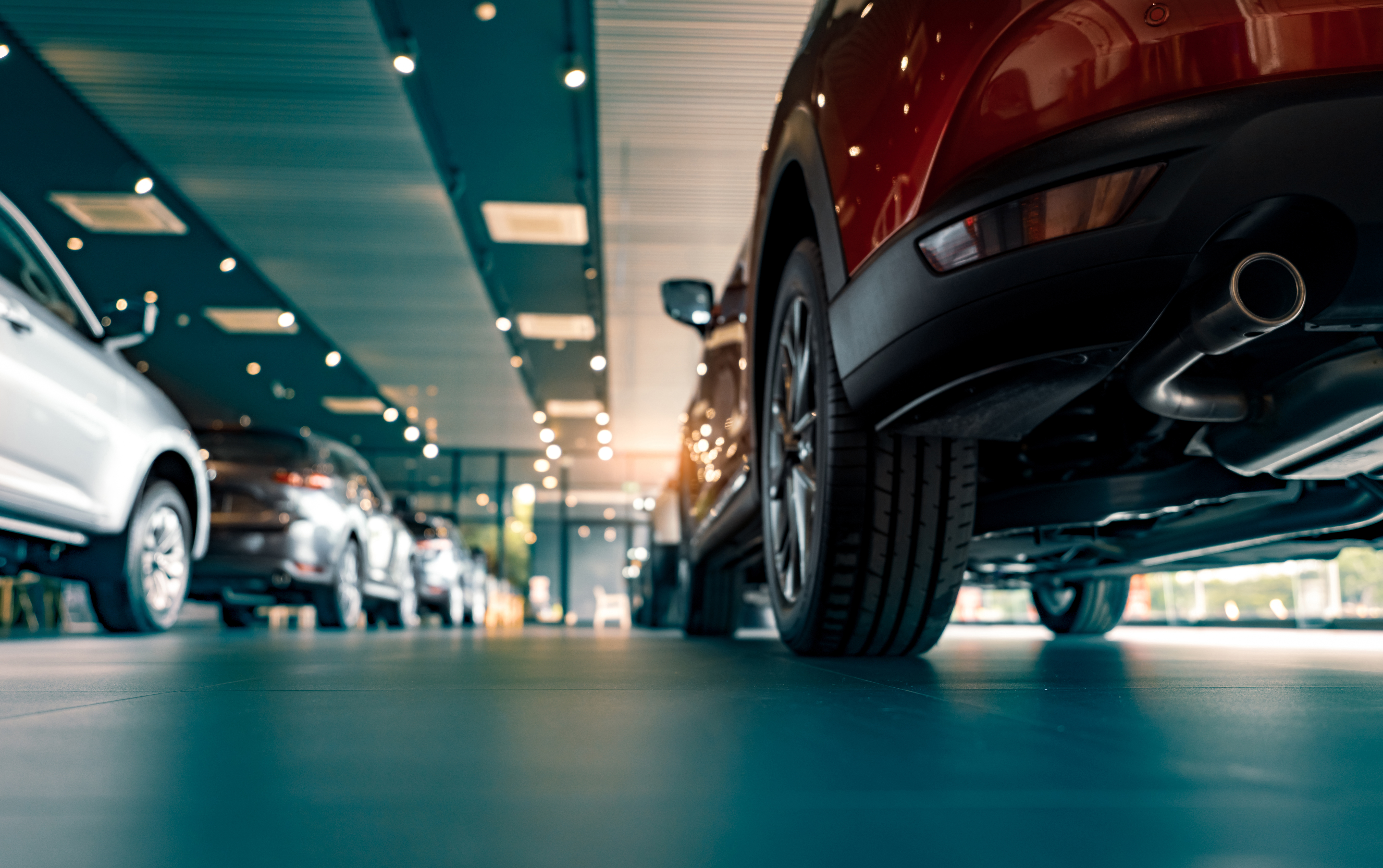 Large-scale hail repair workshop with multiple vehicle bays